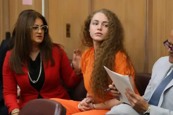 Mandatory Credit: Photo by Carl Juste/TNS via ZUMA Press Wire/Shutterstock (17062696a) Courtney Clenney, center, looks at her family before she pleaded guilty to killing her boyfriend Christian Obumseli in 2022 inside their luxury Miami high-rise, on Monday, Aug. 10, 2026. USA News, Miami, Florida, Us - 10 Aug 2026