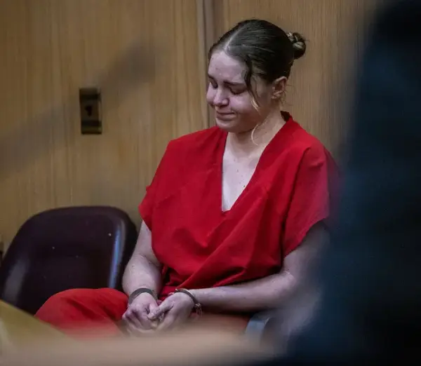 OnlyFans model Courtney Clenney reacts after Judge Laura Shearon Cruz's decision to deny her to get out of jail to await trial during a hearing at the Richard E. Gerstein Justice Building, in Miami, on Thursday, Dec. 8, 2022. She is accused of murdering her boyfriend Christian Obumseli last April, in Miami. (Pedro Portal/Miami Herald via AP, Pool)