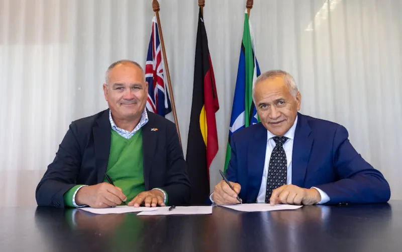 Darren Godwell and Tuku Morgan sign the agreement to from an investment partnership between Indigenous Business Australia and the Waikato-Tainui iwi.