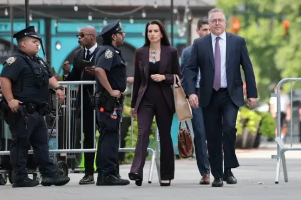 NEW YORK, NEW YORK - AUGUST 14: Karen Friedman Agnifilo and Marc Agnifilo, attorneys for Luigi Mangione, arrive for a court hearing at Thurgood Marshall United States Courthouse on August 14, 2026 in New York City. Mangione is set to appear in court for his federal case, where he is expected to plead guilty to two federal counts of stalking. He is accused of fatally shooting UnitedHealthcare CEO Brian Thompson on Dec. 4, 2024, in Midtown Manhattan. Mangione has pleaded not guilty to the state charges. (Photo by Michael M. Santiago/Getty Images)