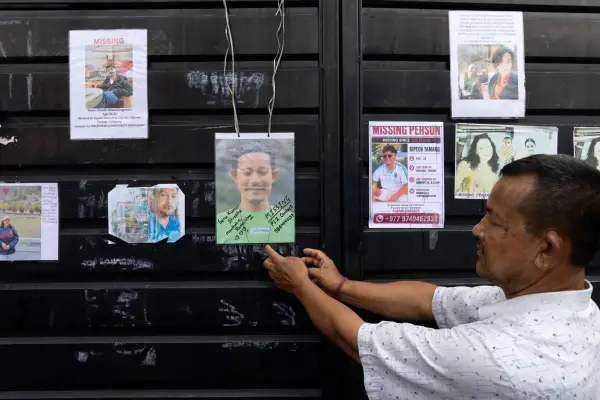 epa13198114 A man pastes photographs of his missing loved ones following flash floods at the Tribhuvan University Teaching Hospital (TUTH), in Kathmandu, Nepal, 29 August 2026. According to National Disaster Risk Reduction and Management Authority (NDRRMA), more than 600 people were killed and hundreds remain missing across northern Nepal after a glacial collapse and avalanche triggered flash floods and mudslides along the Bhotekoshi and Trishuli river valleys near the Nepal-Tibet border, causing widespread destruction to settlements and infrastructure. EPA/NARENDRA SHRESTHA