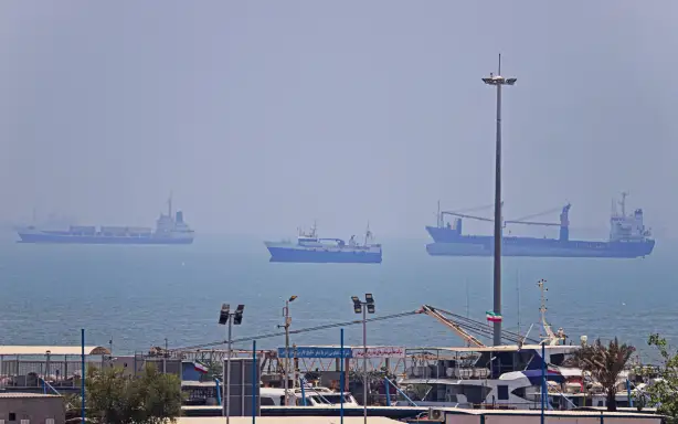Vessels are seen anchored in Bandar Abbas along the Strait of Hormuz on 18 June, 2026.