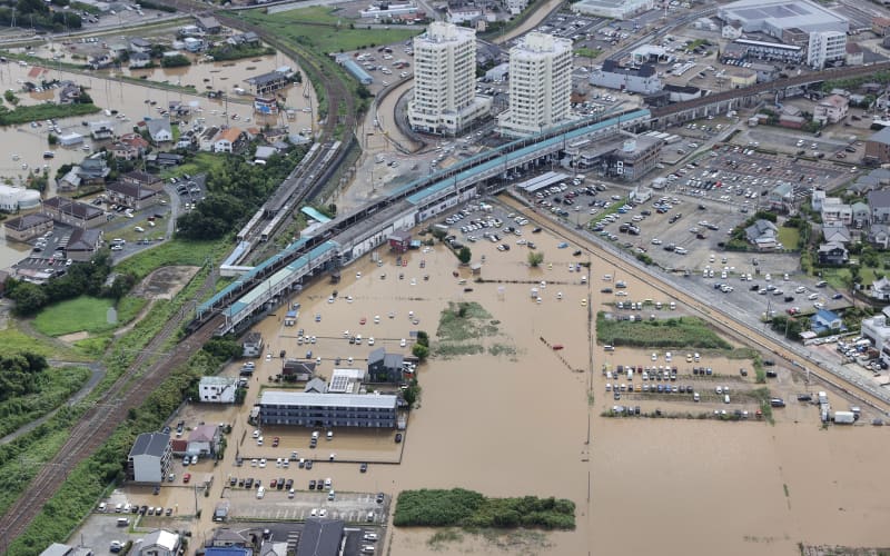 An aerial photo shows widespread flooding around JR Oami Station following torrential rain in Oamishirasato City, Chiba Prefecture, Japan, on August 14, 2026. A linear rainband brought torrential rain to Chiba Prefecture, prompting the Japan Meteorological Agency to issue its highest-level emergency warnings for heavy rain and landslides in Chiba City and other areas from the night of August 13 into early August 14. ( The Yomiuri Shimbun ) (Photo by Daisuke Urakami / The Yomiuri Shimbun via AFP)