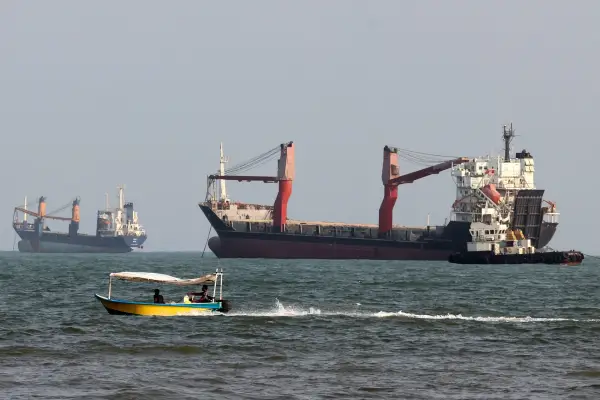 (FILES) Vessels are seen in the Strait of Hormuz, off the port city of Bandar Abbas in southern Iran on August 10, 2026. Iran attacked US military targets in the Middle East on August 31, 2026 in retaliation for American strikes on an island in the Strait of Hormuz, the first exchange of fire for a month in a war that has engulfed the region. (Photo by Atta KENARE / AFP via Getty Images) /