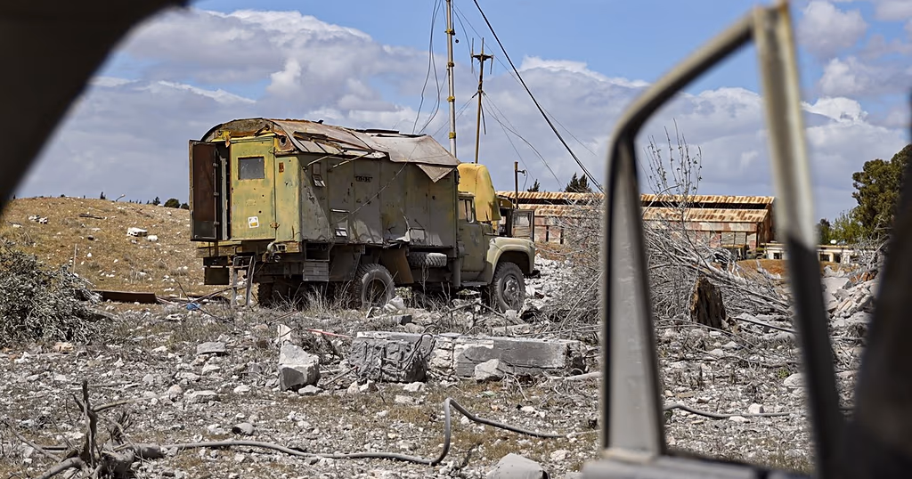 Debris scattered at the site of an Israeli strike on a military airbase near Hama, Syria