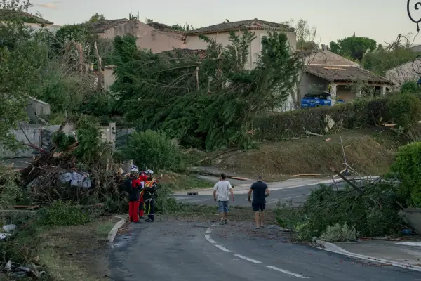 TOPSHOT - This photograph taken on August 24, 2026, shows damaged houses and toppled trees after a tornado struck Pomas, southwestern France. A tornado struck the Aude department on August 24 as part of southwestern France remained under an orange storm alert, with several rooftops torn off in the village of Pomas, an AFP photographer at the scene reported. (Photo by Idriss Bigou-Gilles / AFP via Getty Images)