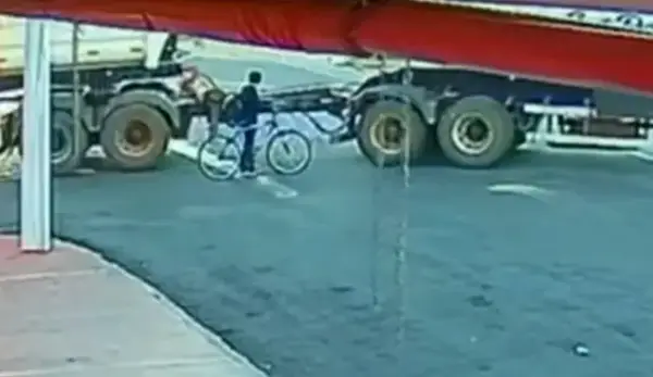 Miraculous moment boy, 12, survives unscathed after being dragged under lorry