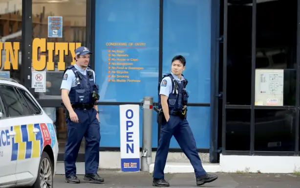 Police and ambulance outside Gun City Penrose on 14 August, 2026.