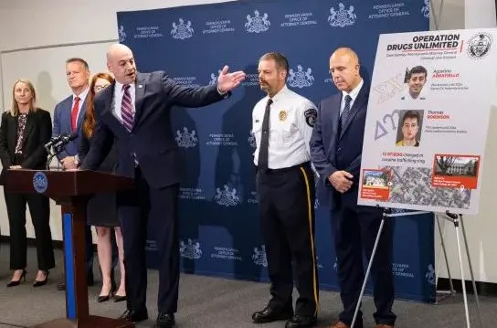 Attorney General Dave Sunday announces charges against 14 people involved in a campus drug ring.