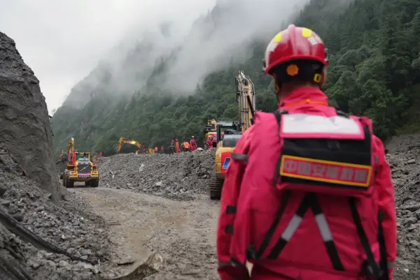 Machines clear a road at the mudslide-hit area in Gyirong County, southwest China's Xizang Autonomous Region, Aug. 29, 2026. A fast-moving chain mudslide, triggered by a high-altitude glacier collapse on the Nepalese side, has caused heavy casualties and left many missing at a port on the China-Nepal border in southwest China's Xizang Autonomous Region. Rescuers immediately launched an all-out effort to reach the mudslide-hit port and search for the missing.