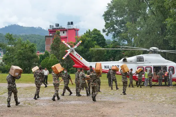 Nepalese army soldiers load relief supplies onto a helicopter for survivors stranded in areas cut off by flash flooding in Nepal's Nuwakot district, Saturday, Aug. 29, 2026. (AP Photo/Dar Yasin)
