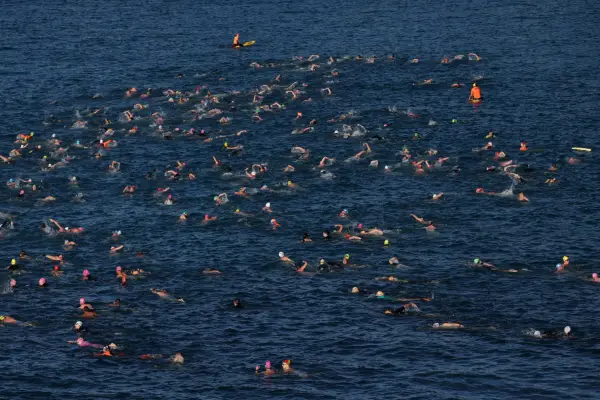 Swimmers participate in a community swim hosted by Coogee Beach Surf Life Saving Club and Randwick City Council, after Sydney mother Leah Stewart was attacked by a shark at the beach last weekend, in Sydney, Australia, June 21, 2026. REUTERS/Hollie Adams