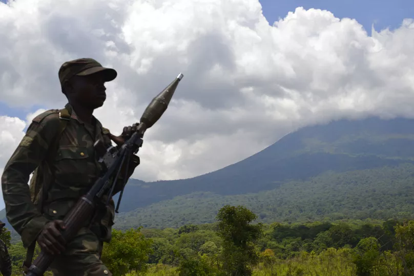  FILE - In this Friday, Oct. 25, 2013 file photo, a Congolese army soldier walks near the frontline during fighting with M23 rebels north of Goma, eastern Congo. 