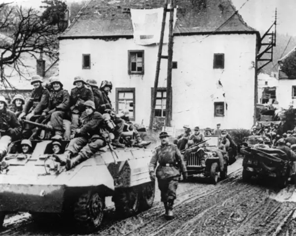 FILE - During the last German counteroffensive on the western front, a German tank unit moves through a village in the Hohe Venn region, near Malmedy, Belgium, Jan. 6, 1945. (AP Photo, File)