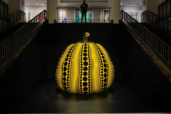(FILES) Yayoi Kusama's sculpture "Pumpkin" is on display during a press preview for Christie's Fall 20/21 Marquee Week in New York, November 8, 2024. Japanese avant-garde artist Yayoi Kusama, known as the "polka dot queen", has died aged 97, a statement from her company said on August 27, 2026. (Photo by kena betancur / AFP via Getty Images) / RESTRICTED TO EDITORIAL USE - MANDATORY MENTION OF THE ARTIST UPON PUBLICATION - TO ILLUSTRATE THE EVENT AS SPECIFIED IN THE CAPTION / TO GO WITH AFP STORY BY Ana FERNANDEZ: "Magritte, Rucha and... a banana, in a bid to set new records at New York auctions"