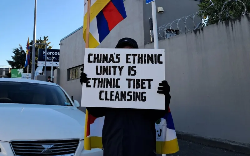 A member of New Zealand's Tibetan community protests outside the Chinese Consulate in Greenlane, Auckland.