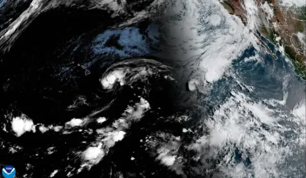 This handout satellite image from the National Oceanic and Atmospheric Administration (NOAA) shows Tropical Storm Lala over the Pacific Ocean as it moves toward Hawaii's main island at 15:20 GMT on August 14, 2026. A strengthening tropical storm named Lala is set to hit Hawaii's Big Island with hurricane force on Saturday, bringing dangerous winds, rainfall and surf as the state's governor declared a state of emergency. (Photo by Handout / NOAA / AFP via Getty Images) / RESTRICTED TO EDITORIAL USE - MANDATORY CREDIT "AFP PHOTO / NOAA / HANDOUT" - NO MARKETING NO ADVERTISING CAMPAIGNS - DISTRIBUTED AS A SERVICE TO CLIENTS