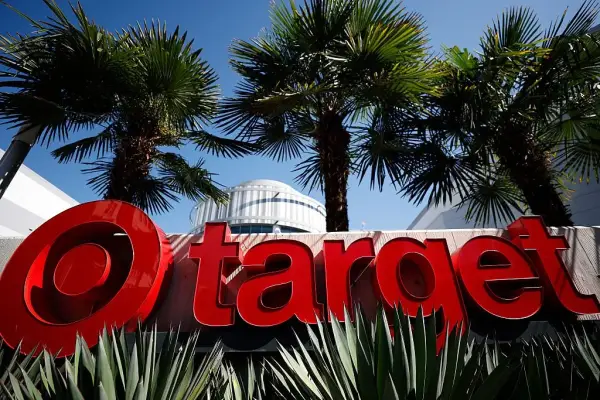 LOS ANGELES, CALIFORNIA - AUGUST 19: The Target logo is displayed outside a Target store on August 19, 2026 in Los Angeles, California. Target shares rose 5% to a 52-week high after the company reported better-than-expected second-quarter earnings, with comparable sales rising 3.8% and net income more than doubling to $1.87 billion, boosted in part by a $994 million tariff refund. The retailer also raised its full-year outlook. (Photo by Justin Sullivan/Getty Images)