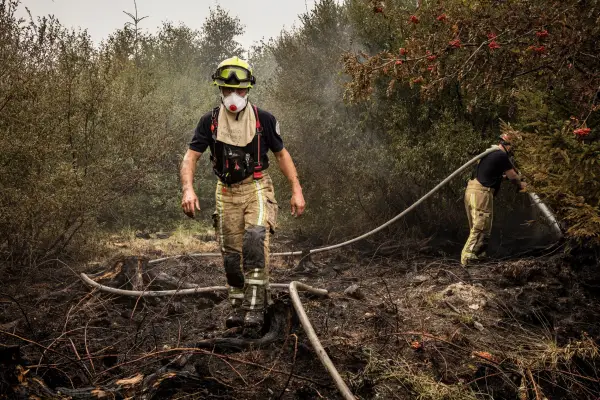 Firefighter work to extinguish wildfires at Hautes Fagnes near Waimes, Belgium, Sunday, Aug. 16, 2026. (Photo AP/Valentin Bianchi)