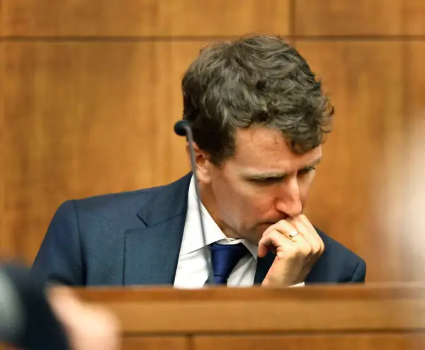 Patrick Clancy reacts as images of himself and his children on vacation a month before they were killed is shown in the courtroom. Testimony in the Lindsay Clancy murder trial at Plymouth Superior Court. Clancy is charged with killing her three children , Cora, Dawson and Callan in their Duxbury home. Monday, July 27, 2026