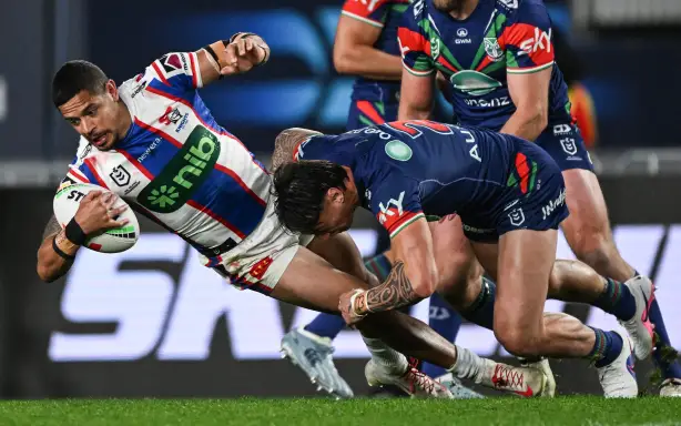 Dane Gagai of the Knights tackled by Charnze Nicoll-Klokstad of the Warriors, NZ Warriors v Newcastle Knights, Week 2 Final of the NRL Telstra Premiership at Eden Park, Auckland, New Zealand on Saturday 20 September 2026.© Photo: Andrew Cornaga / Photosport