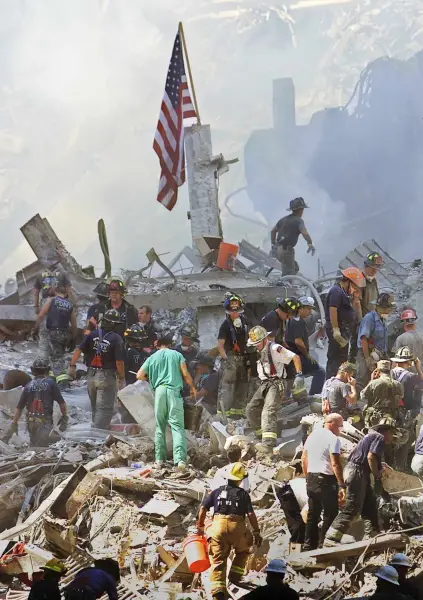 epa13210560 (FILE) - An American flag is posted in the rubble of the World Trade Center in New York, USA, 13 September 2001 (reissued on 04 September 2026). On 11 September 2001, during a series of coordinated terror attacks using hijacked airplanes, two airplanes were flown into the World Trade Center's twin towers, causing the collapse of both towers. A third plane targeted the Pentagon, and a fourth plane heading towards Washington, DC ultimately crashed into a field. The 09/11 attacks were the deadliest terrorist attacks to occur on U.S. soil. In the days that followed, thousands of construction workers, firefighters, police officers, and volunteers flocked to the World Trade Center site to search for survivors and begin recovery efforts. Air travel came to a standstill, and people posted missing-person flyers all over the city as they moved through the dust and ash floating over Lower Manhattan EPA/BETH A. KEISER / POOL / POOL *** Local Caption *** 57149217