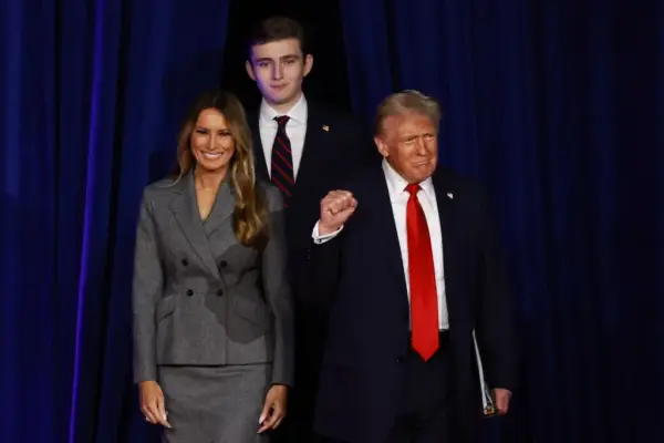 WEST PALM BEACH, FLORIDA - NOVEMBER 06: Republican presidential nominee, former U.S. President Donald Trump arrives to speak with former first lady Melania Trump and Barron Trump during an election night event at the Palm Beach Convention Center on November 06, 2024 in West Palm Beach, Florida. Americans cast their ballots today in the presidential race between Republican nominee former President Donald Trump and Vice President Kamala Harris, as well as multiple state elections that will determine the balance of power in Congress. (Photo by Joe Raedle/Getty Images)