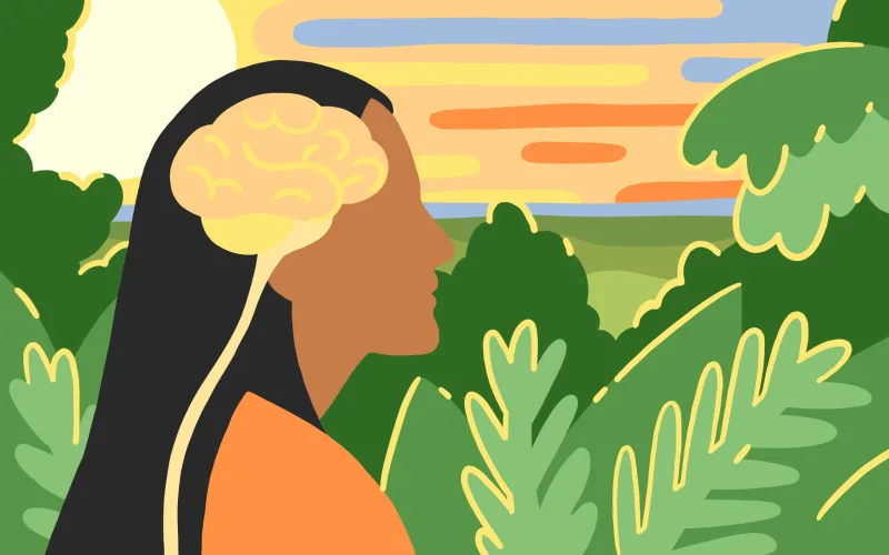 Profile of person and brain with vibrant coloured bush foliage and ocean sunset.