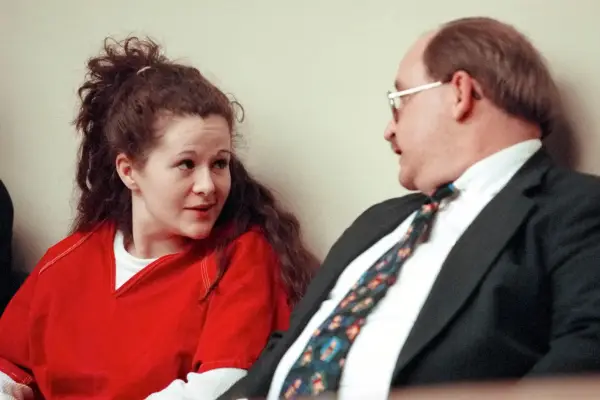 Convicted killer Christa Gail Pike confers with her attorney during a motions hearing.