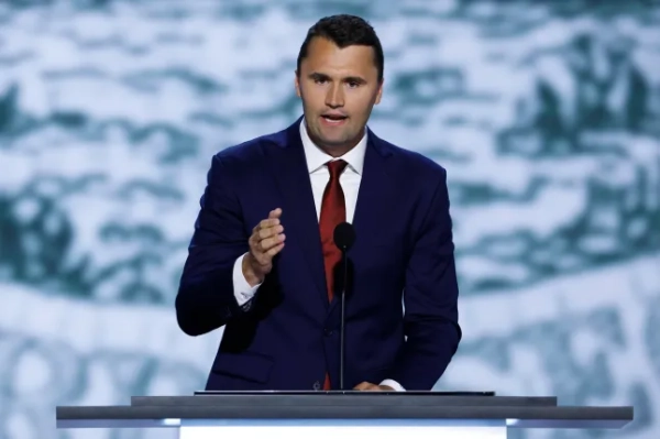 CEO of Turning Point USA Charlie Kirk speaks on stage on the first day of the Republican National Convention at the Fiserv Forum